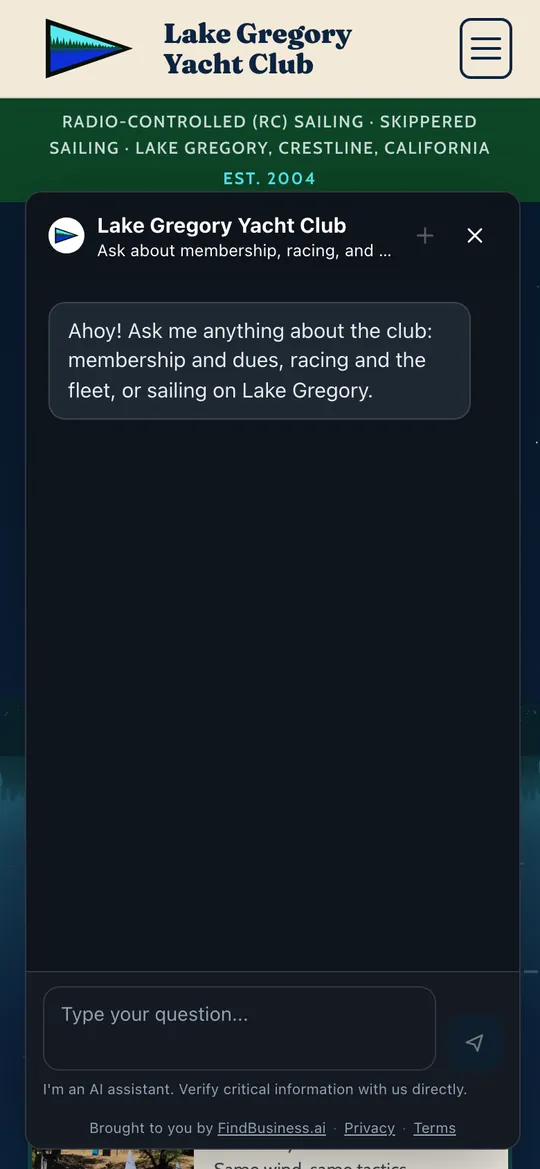 Lake Gregory Yacht Club's website on a phone with its AI agent open, its greeting invites questions about membership, racing and the lake.